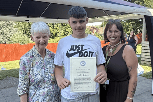 Rotary club member, Maggie Wilson, presents The Tony Field Award to Lesta Brown, watched by Melton Learning Hub operations manager, Lucie Larke