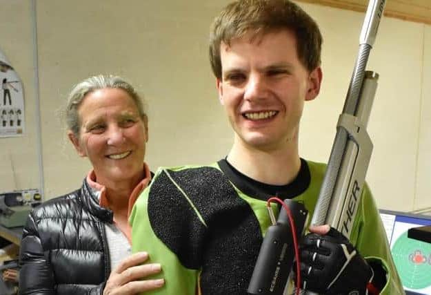 Amanda's brother, Michael Whapples, who is a champion shooter