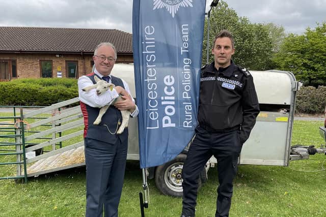 Leicestershire and Rutland Police and Crime Commissioner Rupert Matthews with one of the visiting lambs and Sgt Paul Archer, of the Rural Crime Team