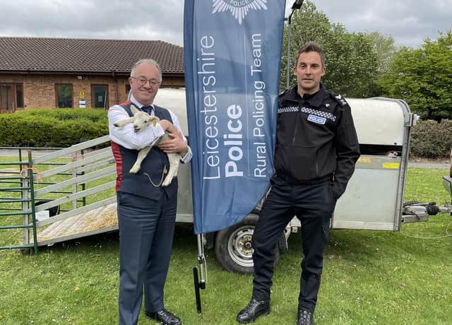 Leicestershire and Rutland Police and Crime Commissioner Rupert Matthews with one of the visiting lambs and Sgt Paul Archer, of the Rural Crime Team