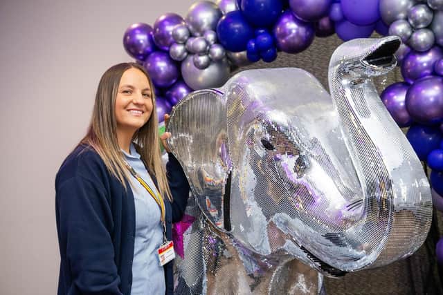 LOROS day hospice nurse, Amy Brown, with one of the elephant sculptures auctioned off in aid of the charity IMAGE Beth Walsh Photography- www.bethwalsh.co.uk]