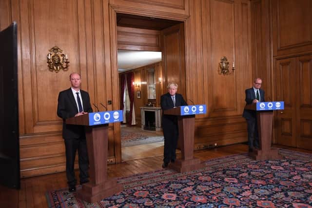 Britain's Prime Minister Boris Johnson (C), Britain's Chief Medical Officer for England Chris Whitty (L) and Britain's Chief Scientific Adviser Patrick Vallance (R) attend a virtual press conference at Downing Street on September 9 (Photo: STEFAN ROUSSEAU/POOL/AFP via Getty Images)