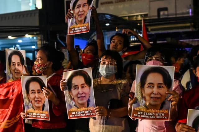 NLD supporters celebrate in front of the party's headquarters in Yangon following a landslide victory in the November 2020 election (Photo: YE AUNG THU/AFP via Getty Images)