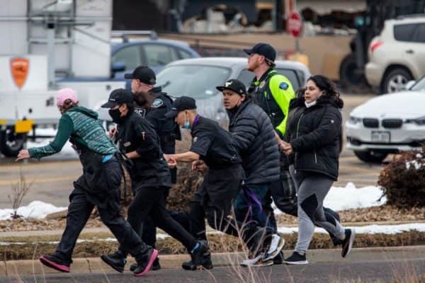 Police led terrified shoppers away from the scene, many through back entrances and retail loading docks (Photo: Chet Strange/Getty Images)