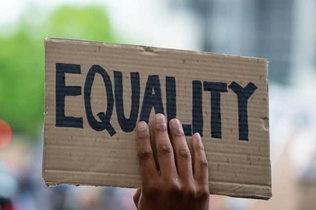 Racism still an issue but becoming “less important” says government Commission (credit: Shutterstock)