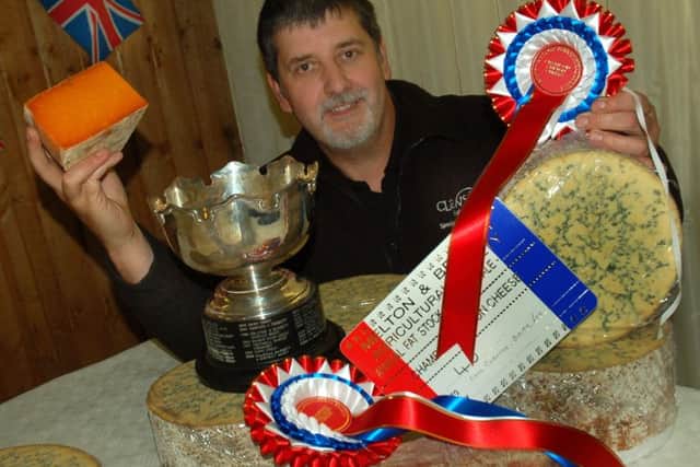 Richard Mayfield, head cheesemaker at Long Clawson Dairy, shows off the company's haul from this year's fatstock show EMN-170512-165759001