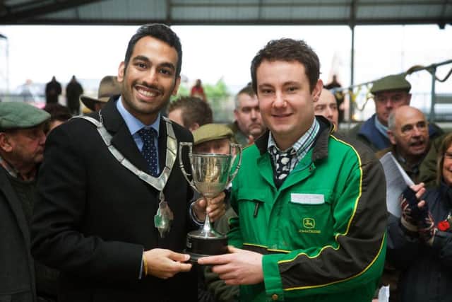 Robert West receives the trophy for champion lamb from Melton Mayor, Councillor Tejpal Bains, at the Christmas Fatstock Show
?Tim Scrivener Photographer 07850 303986
....Covering Agriculture In The UK.... EMN-170512-165736001
