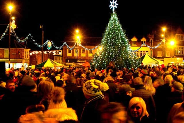The Christmas tree and lights glow in the town centre EMN-170412-105736001