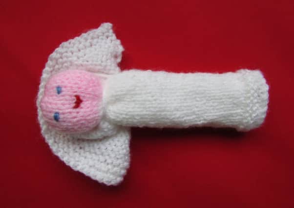 A knitted angel made by the churchs Knit and Chat group PHOTO: Supplied