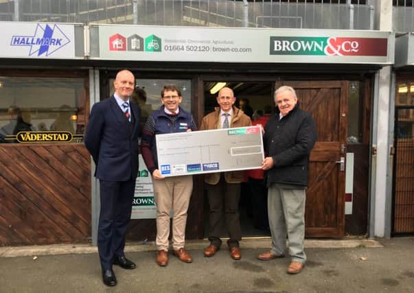 Representatives of Brown & Co Melton Mowbray present cheque for Â£3,000 to Derbyshire, Leicestershire and Rutland Air Ambulance's Roy Stevenson PHOTO: Supplied