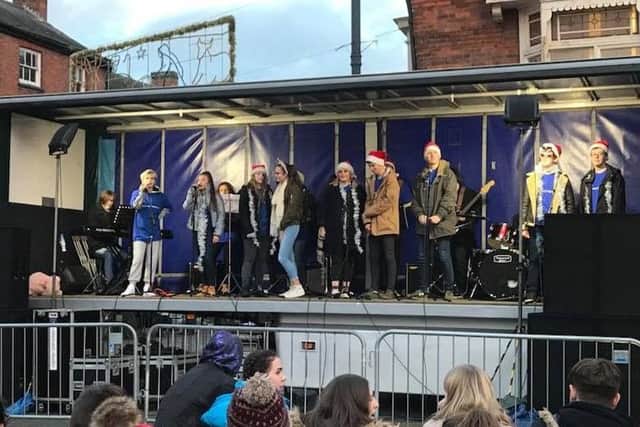 Students promoting their Boogie Nights 'The 70's Musical' show at Melton's Christmas market PHOTO: Supplied