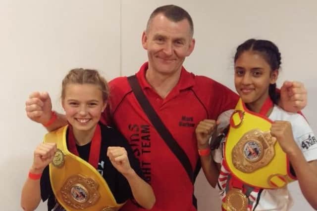 Lexi Peters (left) and Aliza Agwan, pictured with instructor Mark Barlow, won World Cup belts in Benidorm EMN-171212-165631002