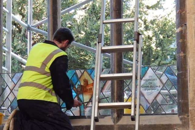 Workmen install the new stained glass window at St Mary's Church in Melton.
PHOTO PHIL BALDING EMN-171218-175613001