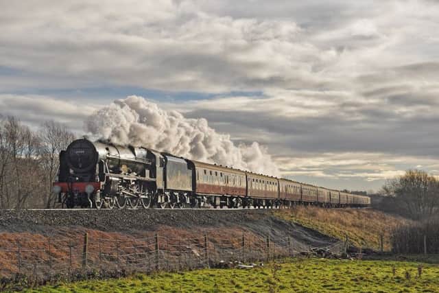 The 46100 Royal Scot steam train on a Christmas festive charter train to York, pictured it at Wymondham Crossing.
PHOTO PAUL DAVIES EMN-171219-143219001