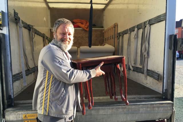 Lee Driver loading furniture into his van PHOTO: Supplied
