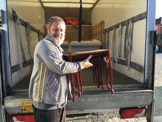 Lee Driver loading furniture into his van PHOTO: Supplied