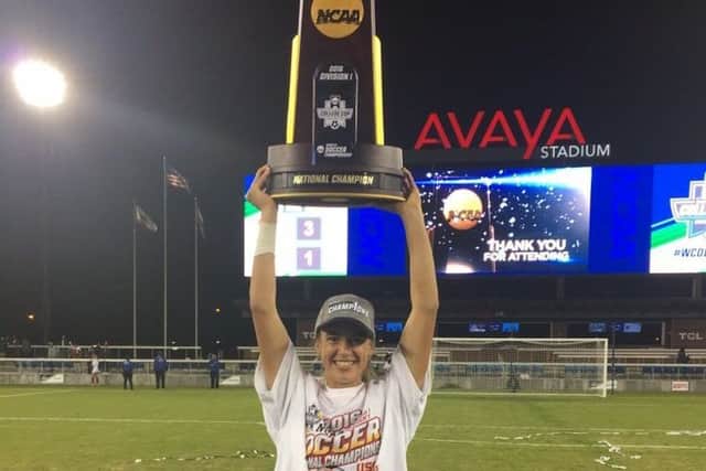 Ashleigh becomes only the second Englishwoman to lift the NCAA National Championship trophy EMN-171219-173452002