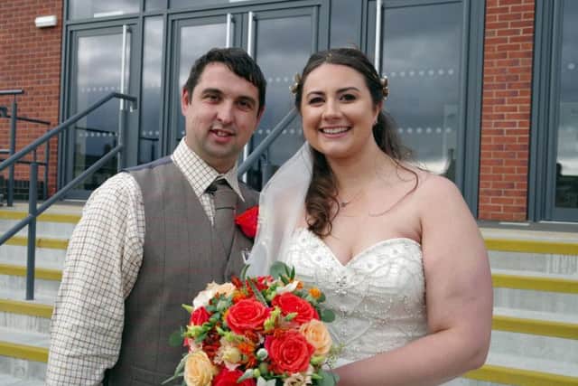 Adam and Abi Nadolski pictured after getting married at Melton Cattle Market
PHOTO Chris Senior of Senior Photography EMN-171221-104519001