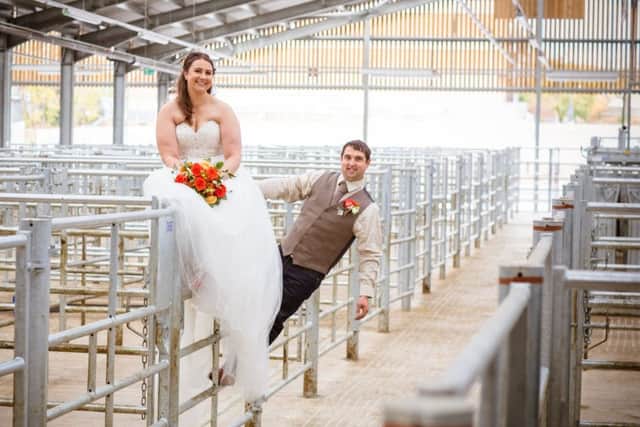 Adam and Abi Nadolski on the livestock gates following their wedding at Melton Cattle Market
PHOTO Chris Senior of Senior Photography EMN-171221-104618001