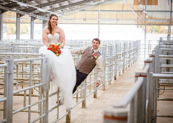 Adam and Abi Nadolski on the livestock gates following their wedding at Melton Cattle Market
PHOTO Chris Senior of Senior Photography EMN-171221-104618001