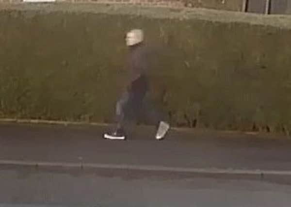 A CCTV still of a man police want to speak to in connection with a distraction burglary in Melton in which a 91-year-old man was conned out of Â£200 in cash EMN-171221-131226001