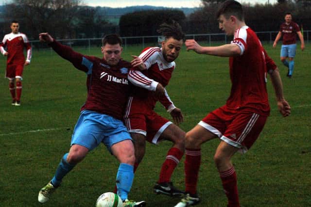 Liam Ambrose and George Coser battle to win back possession EMN-171227-091807002