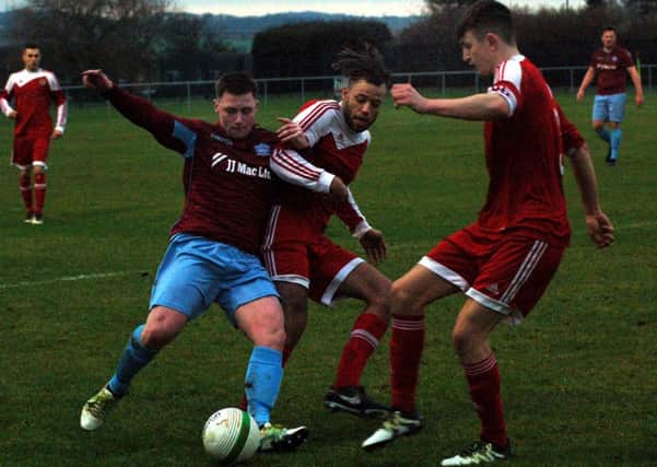 Liam Ambrose and George Coser battle to win back possession EMN-171227-091807002