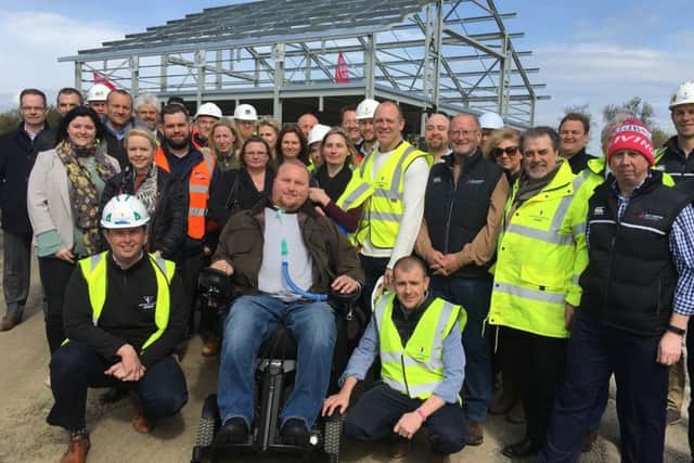 Matt Hampson and his foundation members and partners with former England rugby captain Mike Tindall, at the topping out ceremony for the Get Busy Living Centre at Burrough-on-the-Hill EMN-180301-090506001
