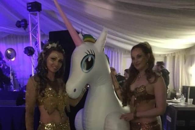 Entertainers with one of the giant unicorns PHOTO: Supplied