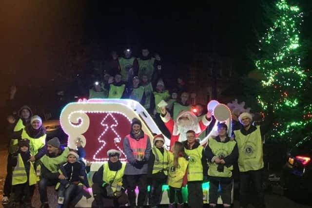 Lions, families and friends who gave hundreds of hours of their time to help Santa visit so many PHOTO: Supplied