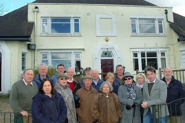 Melton borough councillor Leigh Higgins outside The Fox Inn at Thorpe Satchville and villagers who want to see it reopen as a viable business EMN-180901-153203001