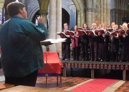 Musical director James Gutteridge conducts members of Melton Mowbray Choral Society EMN-180901-102822001