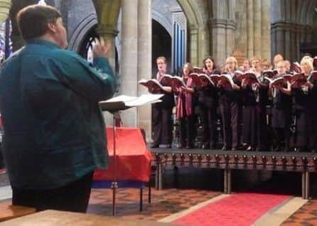 Musical director James Gutteridge conducts members of Melton Mowbray Choral Society EMN-180901-102822001