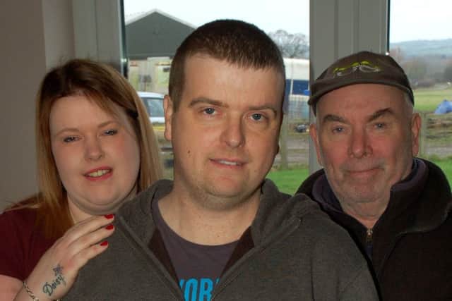 Andrew Ogleby, who is having treatment for cancer, with his sister Sarah Jane and their father Richard EMN-180115-115455001