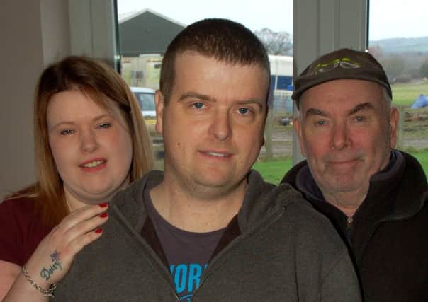 Andrew Ogleby, who is having treatment for cancer, with his sister Sarah Jane and their father Richard EMN-180115-115455001