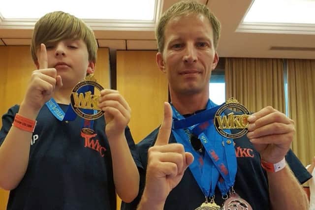 World champion martial artist Brent Penniston (right) with son Morgan EMN-180116-114521002