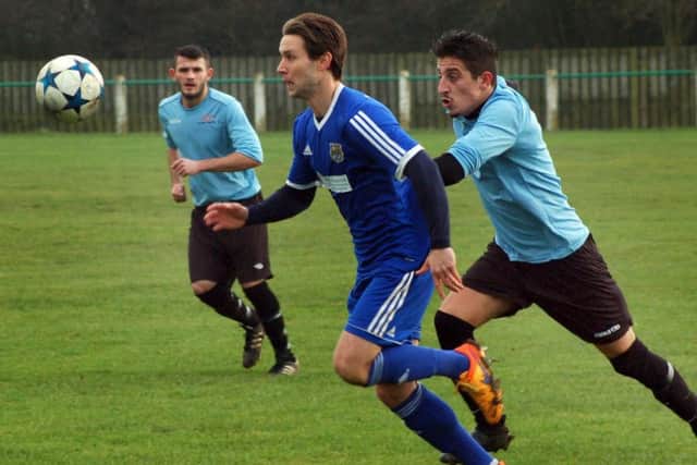 Asfordby FC, pictured during their quarter-final win, are chasing league and cup honours in their first season EMN-180116-160956002