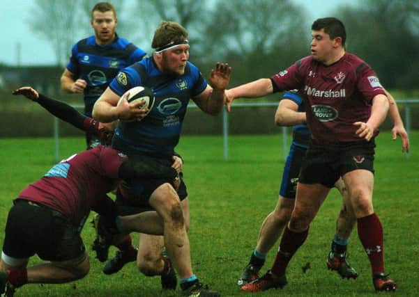 Charlie Loveday lines up a tackle against maurauding Syston EMN-180130-113551002