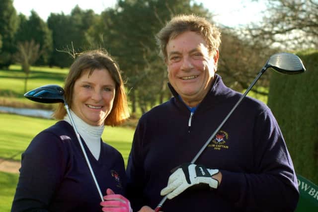 Lady captain Sandie Normanton and club captain Glenn Price EMN-180130-125000002