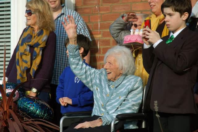 Joan Hart and family members wave to the DAC horses and riders after they arrived to celebrate her 100th birthday EMN-180129-103107001