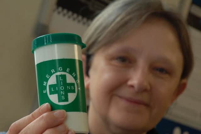 PCSO Karen Evans, who is based at Melton police station, with one of the special bottles being given out to vulnerable residents EMN-180129-141454001