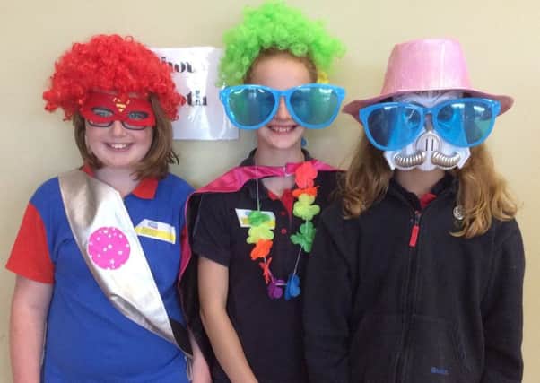 Guides in silly disguise at Long Clawson Village Hall as part of the Leicestershire Centenary Celebrations PHOTO: Supplied