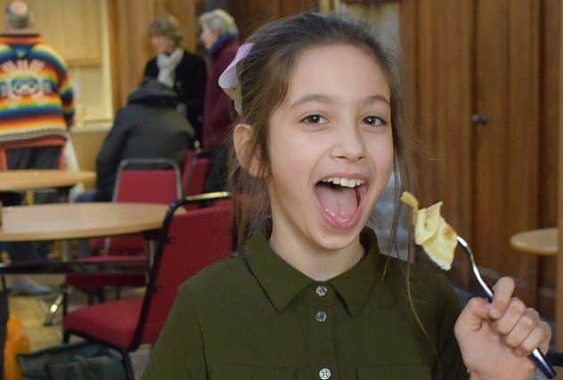 Nine-year-old Aiesha Ates tucking in to a pancake PHOTO: Supplied