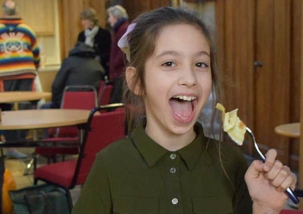 Nine-year-old Aiesha Ates tucking in to a pancake PHOTO: Supplied