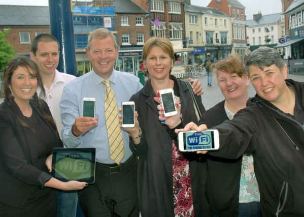 Melton Bid directors and managers Siobhan Lane, Mark Cook, Andrew Cooper, Shelagh Core, Julie Swain and Sarah Browne celebrate the launch of free wifi in the town EMN-180602-103837001