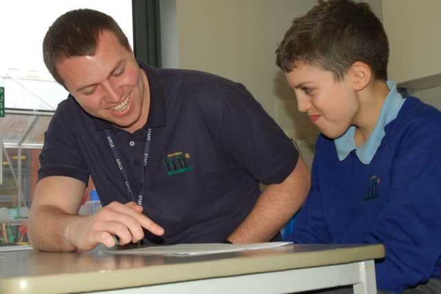 Teacher Rob Peet with Charlie Shahram-Niya at Birch Wood Area Special School at Melton EMN-180602-172636001