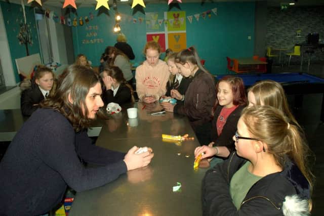 Staff member Brian Norris runs the snack bar at The Venue EMN-180902-135544001