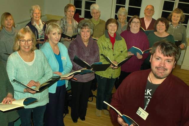 Musical director James Gutteridge with members of Melton Mowbray Choral Society EMN-180213-093642001