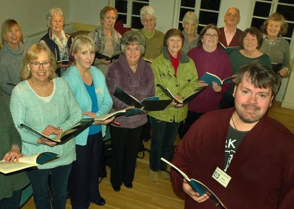 Musical director James Gutteridge with members of Melton Mowbray Choral Society EMN-180213-093642001