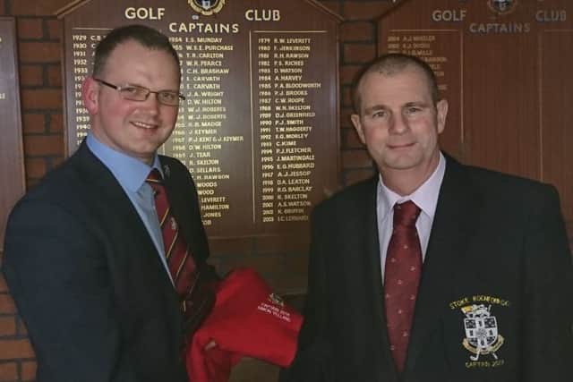 New skipper Simon Yelland (left) receives the captains sweater from Martin Harvey EMN-180216-085559002